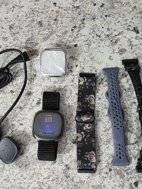 fitbit Black Smartwatch with Floral and Blue Interchangeable Bands